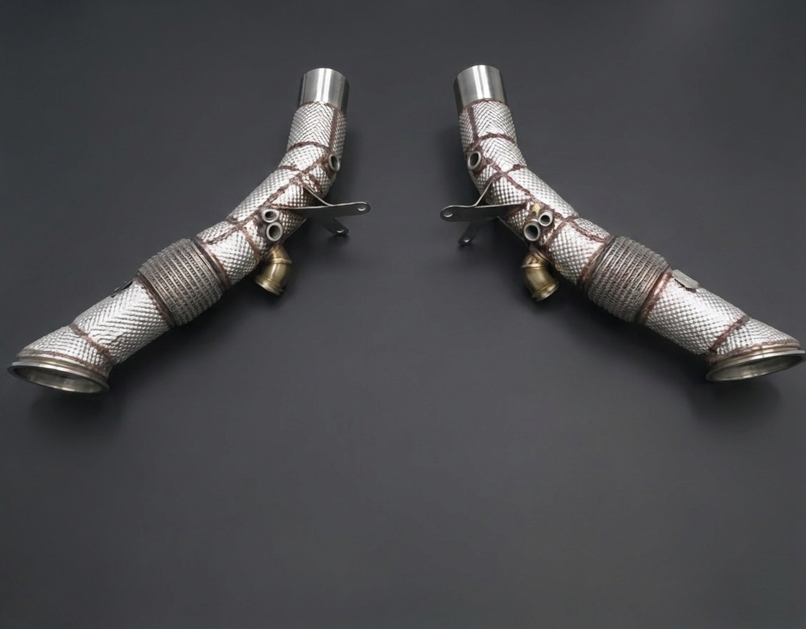 Ferrari SF90 catless downpipes with thermal heat shielding and sensor bungs